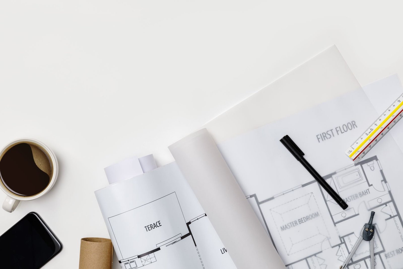 Lease documents and a permit set on a job table